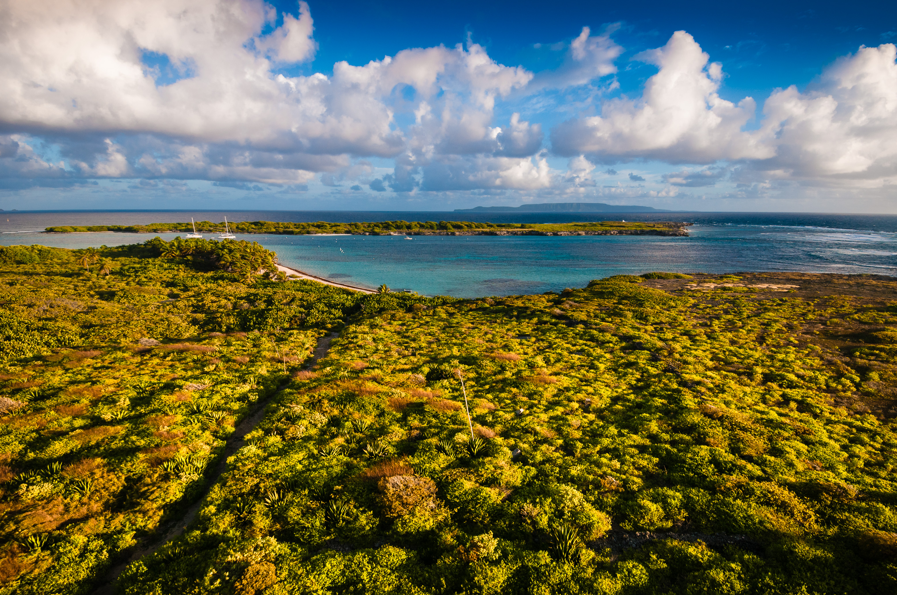 France, Caraïbes, Petites Antilles, Réserve naturelle nationale de Petite Terre, vue sur le lagon, Terre-de-Haut et l'île de La Désirade depuis le phare de Terre-de-Bas au coucher du soleil // France, Caribbean, Lesser Antilles, Petite Terre National Nature Reserve, view of the lagoon, Terre-de-Haut and La Désirade from the lighthouse of Terre-de-Bas at sunset